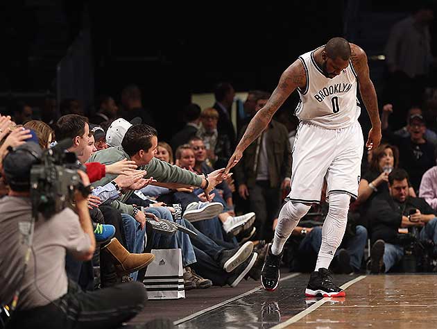 Andray-Blatche-enthusiastically-glad-hands.-Bruce-Bennett-Getty-Images.jpg